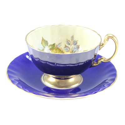 Lot 1007 - An Aynsley "Cabbage Rose" cobalt blue teacup...