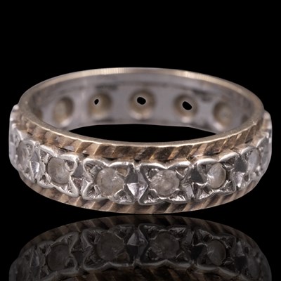 Lot 1268 - A 1960s white gemstone and 9 ct gold eternity...