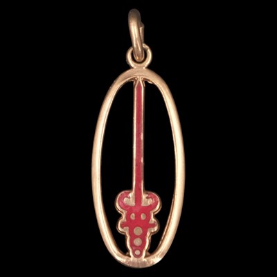 Lot 1346 - A vintage red-enamelled 9 ct yellow metal...