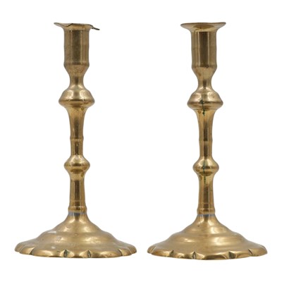 Lot 861 - A pair of Georgian brass candlesticks,...