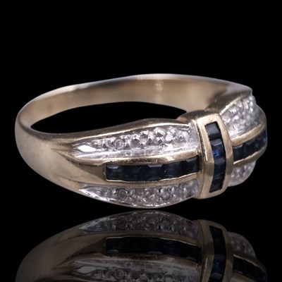 Lot 1305 - A near-contemporary diamond and sapphire ring,...