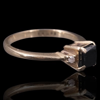 Lot 1306 - A near-contemporary sapphire and diamond ring,...