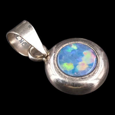 Lot 1316 - A contemporary Modernist opal doublet circular...