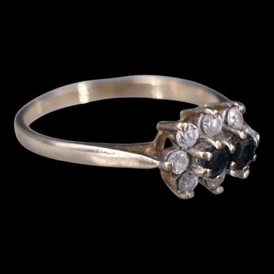 Lot 1319 - A 1980s sapphire and paste ring, comprising a...
