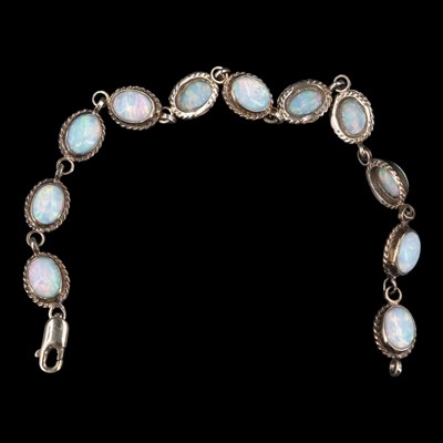 Lot 1325 - A near-contemporary opal and 9 ct gold...