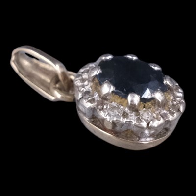 Lot 1326 - A vintage sapphire and diamond cluster pendant,...