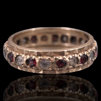 Lot 1329 - A late 20th Century red and white gemstone set...