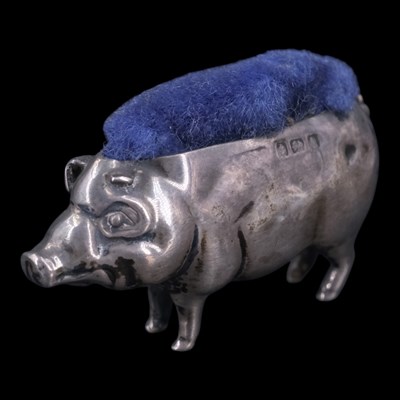 Lot 1067 - An Edwardian silver pin cushion in the form of...