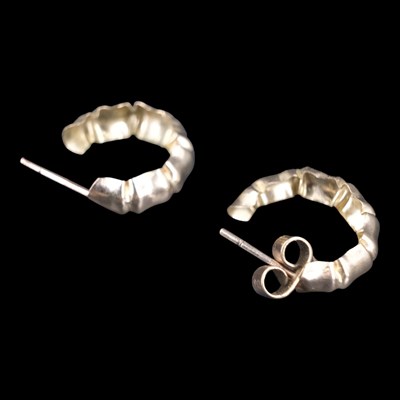 Lot 1339 - A pair of 9 ct yellow metal hoop...