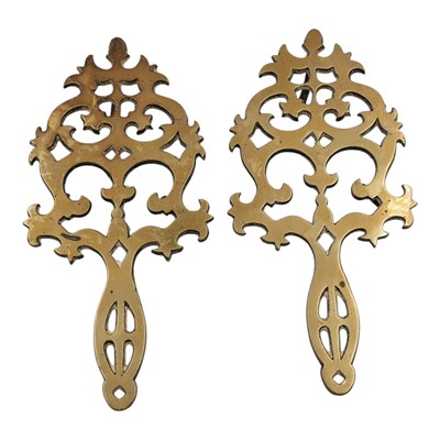 Lot 886 - A pair of Victorian brass trivets / iron...