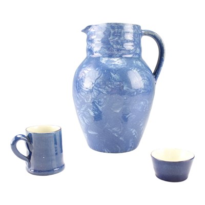 Lot 977 - A large blue slipware jug, together with a...