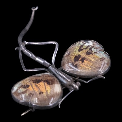 Lot 1209 - A vintage butterfly wing and white metal...