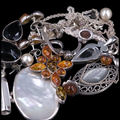 Lot 1212 - A group of contemporary amber, black onyx,...