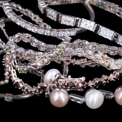Lot 1216 - A group of contemporary gemstone-set white...