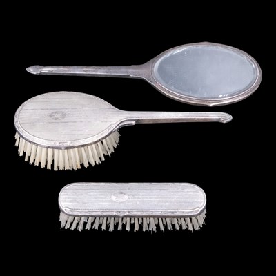Lot 1108 - A 1940s silver three-piece dressing table set,...