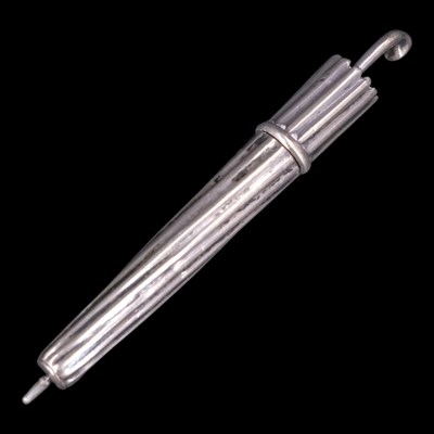 Lot 1113 - A vintage novelty white metal umbrella-form...