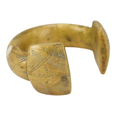Lot 929 - A Nigerian Tuareg heavy brass currency bangle...