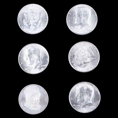 Lot 394 - Five US "Kennedy" silver half dollar coins,...