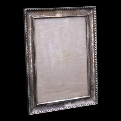 Lot 1065 - An Edwardian silver photograph frame, retailed...