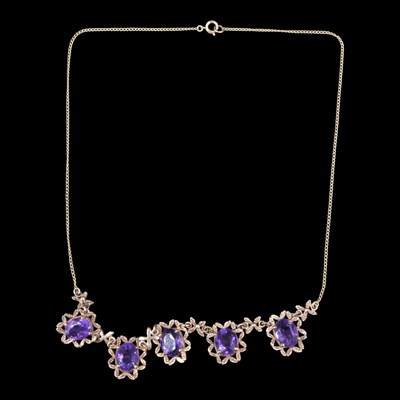 Lot 1357 - A 1960s amethyst and 9 ct gold garland...
