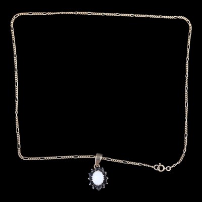 Lot 1359 - A near-contemporary opal and sapphire cluster...