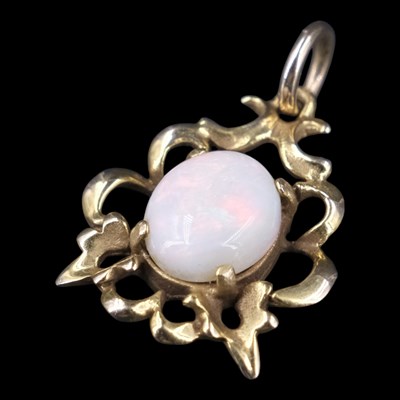 Lot 1363 - A 1990s opal and 9 ct gold openwork...