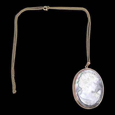 Lot 1371 - A 1970s abalone shell and 9 ct gold cameo...