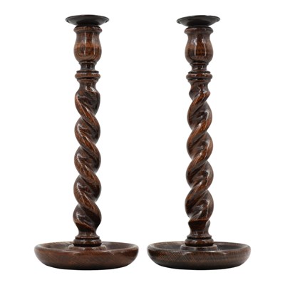 Lot 895 - A pair of 1920s twist-turned oak candlesticks,...