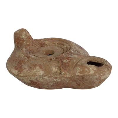 Lot 927 - A Roman terracotta oil lamp, circa 1st - 4th...