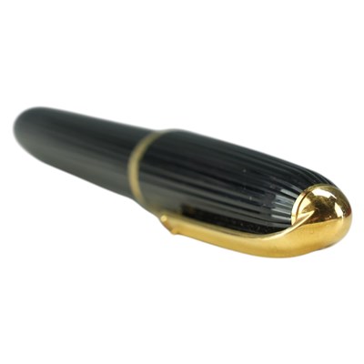 Lot 467 - A vintage Cartier ribbed black lacquer and...