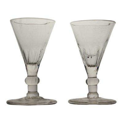 Lot 1054 - A pair of Georgian wine glasses, having...
