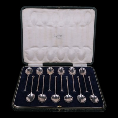 Lot 1163 - A cased set of twelve silver seal-top...