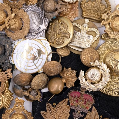 Lot 35 - British military and other cap badges etc,...