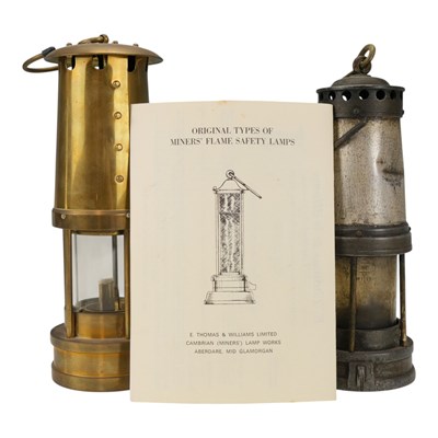 Lot 627 - Two miners' safety lamps, by Thomas & Williams...