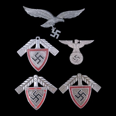 Lot 121 - A group of German Third Reich cap badges, (a/f)