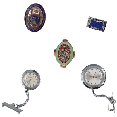 Lot 502 - A group of nursing badges, including a City...