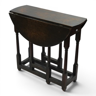 Lot 1594 - An old reproduction joined oak gateleg...