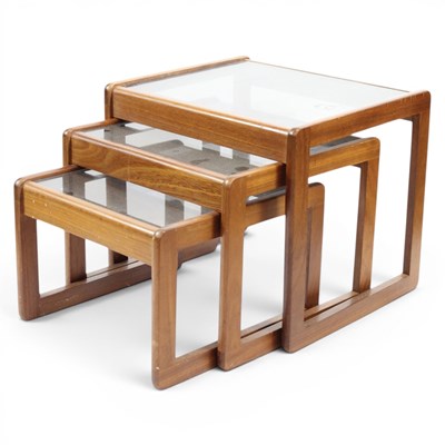 Lot 1641 - A mid-Century style nest of glass-topped teak...