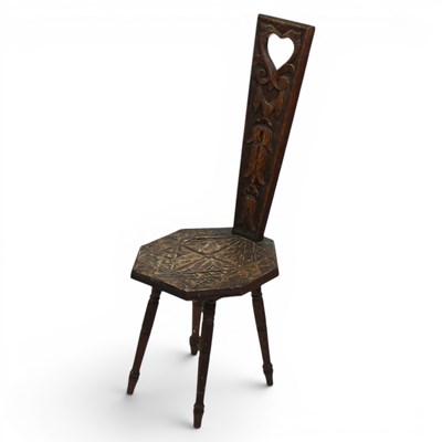 Lot 1656 - An early 20th Century carved oak spinning stool