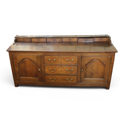 Lot 1657 - A George III joined oak low dresser, 190 cm x...
