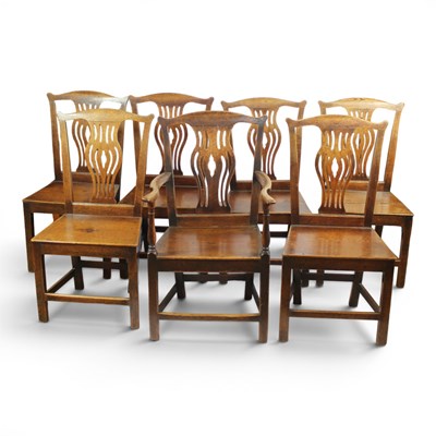 Lot 1680 - A set of seven George III oak dining...
