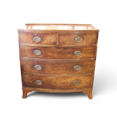Lot 1687 - A late Georgian bow-fronted mahogany chest of...
