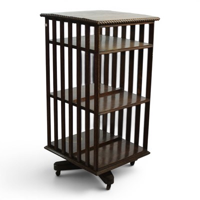 Lot 1690 - An early 20th Century oak revolving bookcase,...