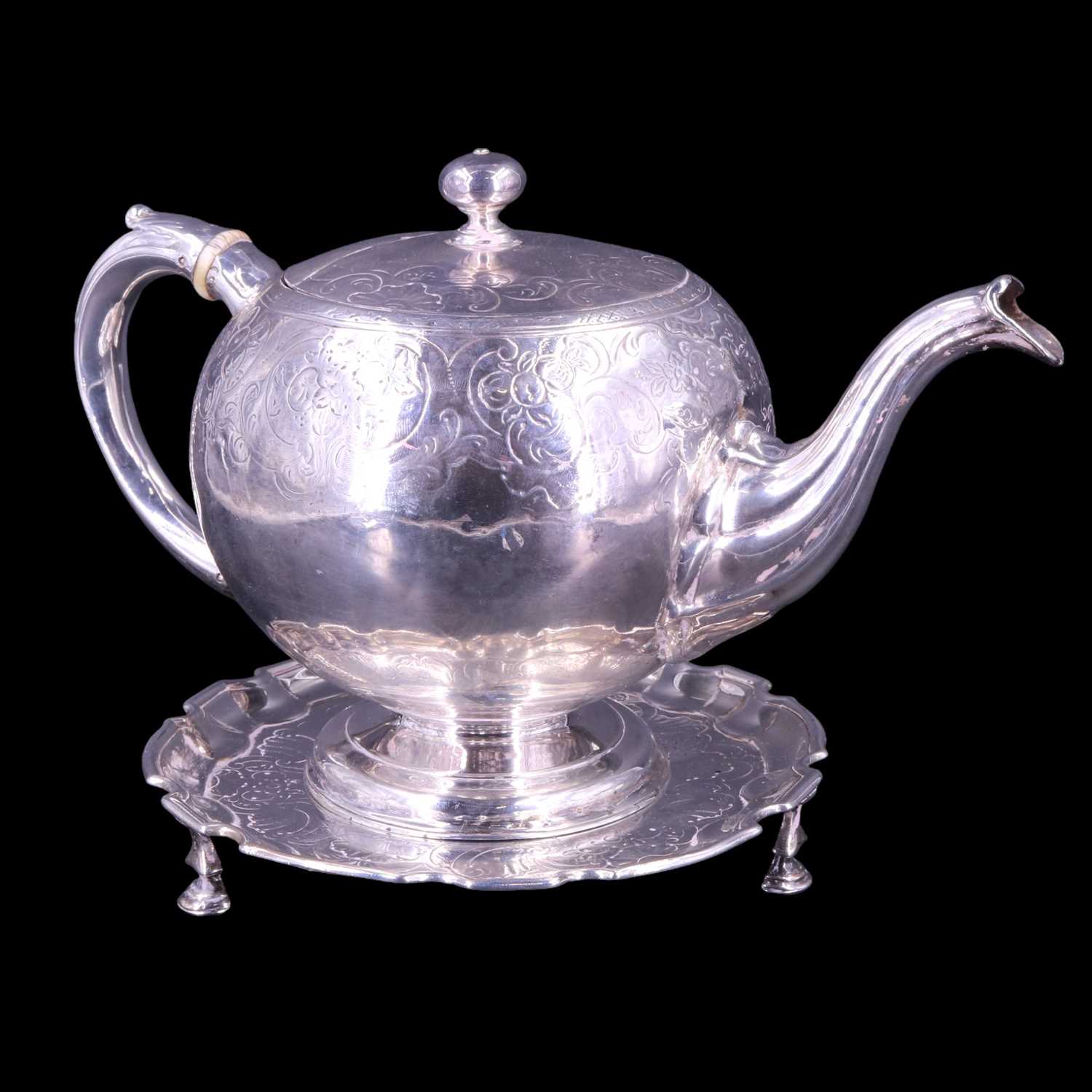 Lot 826 - A George II Scottish silver teapot and stand,...