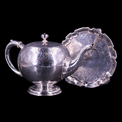 Lot 826 - A George II Scottish silver teapot and stand,...